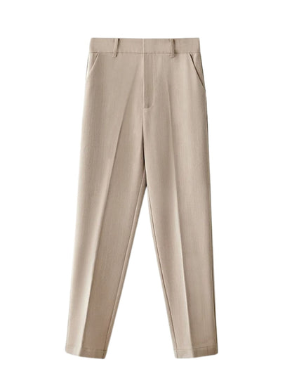Beige tailored trousers laid flat