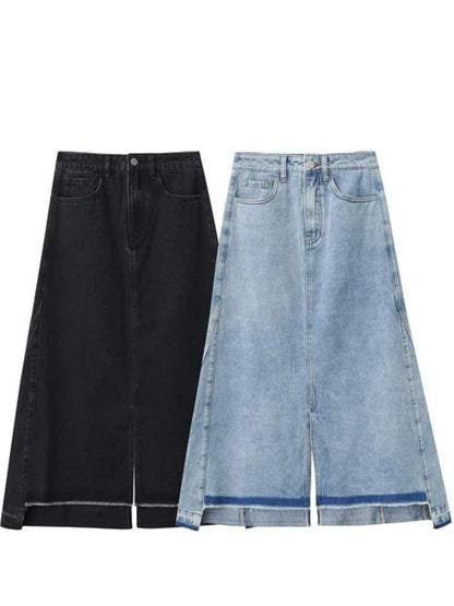 Flat lay of black and light blue denim midi skirts. Both skirts feature front slit and contrast hemline details
