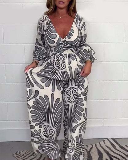 Myla | Loose Jumpsuit with Deep V-Retro Print and Bell Sleeves