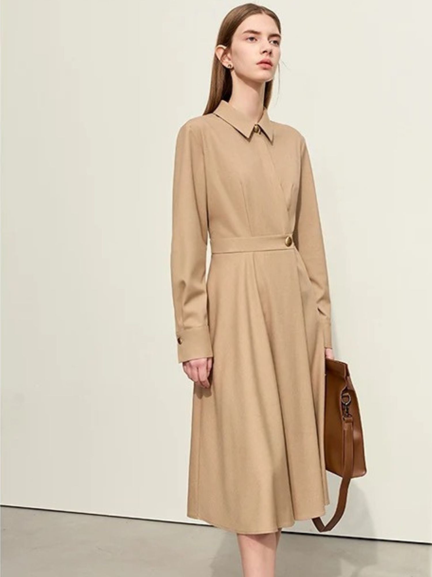 Side walking view of camel shirt dress with structured waist and long sleeves