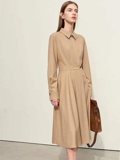 Side walking view of camel shirt dress with structured waist and long sleeves